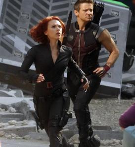 Black Widow (Scarlett Johansson) and Hawkeye (Jeremy Renner)  dash from the crashed Quinjet